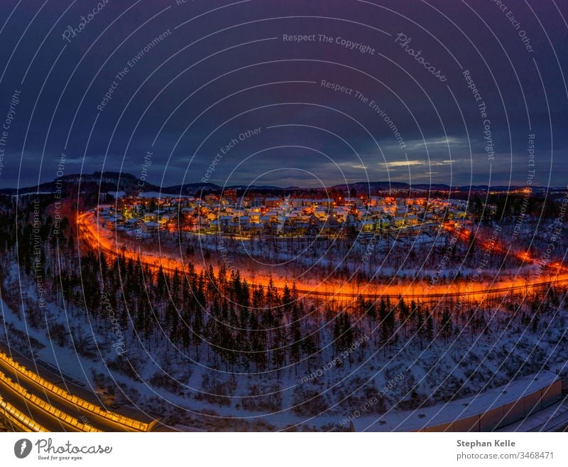 Winter cityscape of the town Albstadt in Baden Wuerttemberg, germany at the late evening hour with glowing lights. landscape snow view living Neighborhood dawn