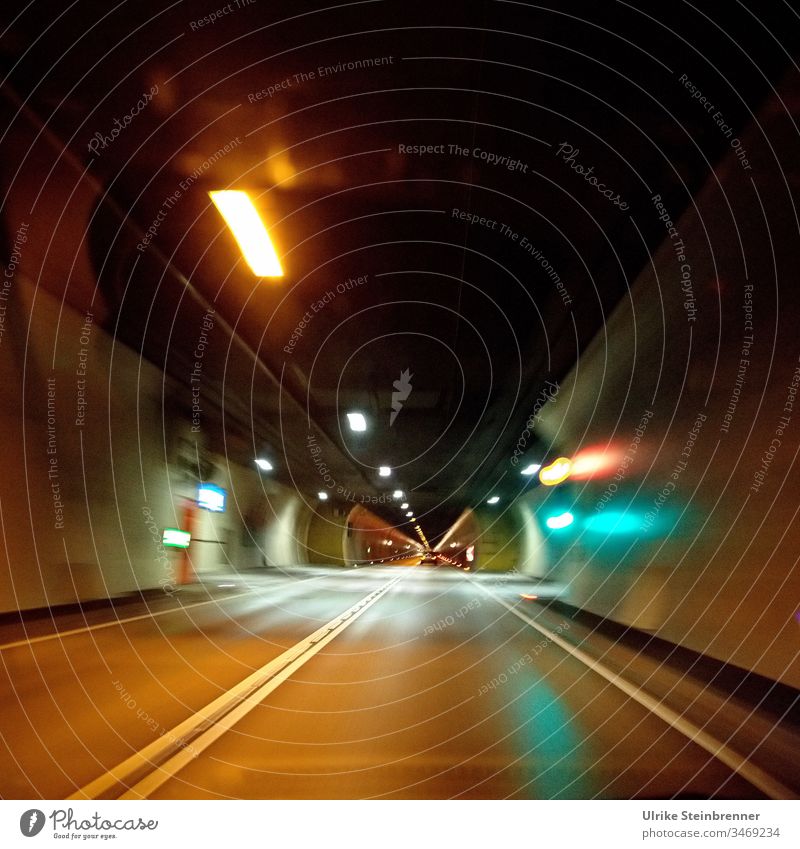 Drive through an illuminated car tunnel car tunnels Tunnel Transport Street Light Highway conceit Night Traffic infrastructure Tunnel vision road tunnels