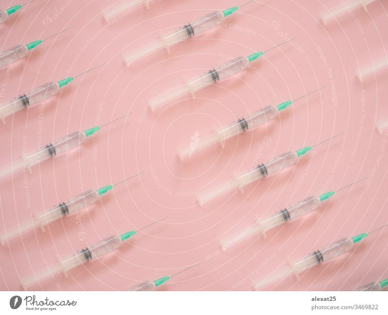 Syringe pattern on pink background antibiotic coronavirus covid-19 disease dose drug epidemic equipment health healthy hospital illness infection inject