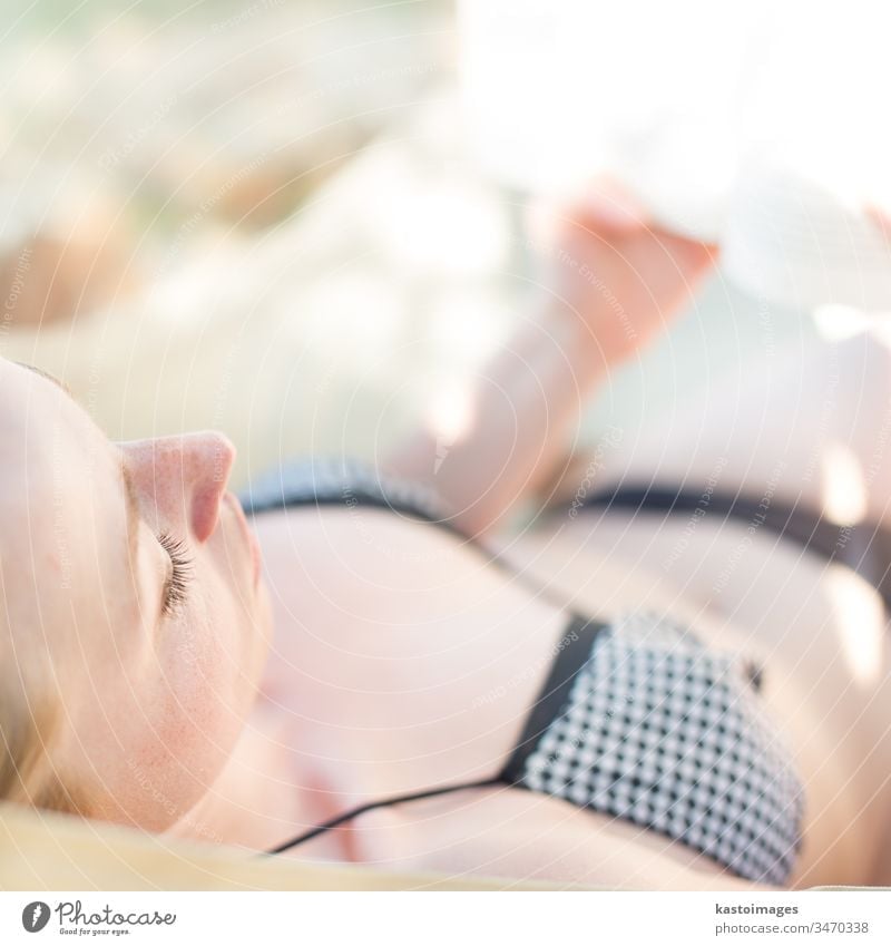 Lady reading a book in hammock. - a Royalty Free Stock Photo from Photocase