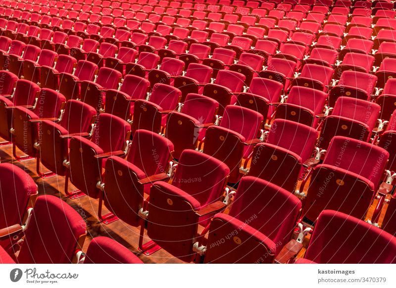 Red color theatre chair in conference room. seat interior auditorium empty theater cinema red hall nobody row seating meeting movie event entertainment audience