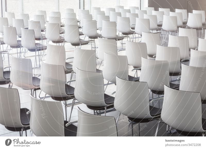 Empty white chairs in contemporary conference hall with lecture hall architecture business auditorium classroom presentation seat row nobody empty education