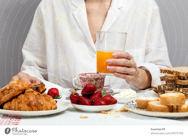 Unrecognizable woman having breakfast in pajamas at home in quarantine food morning lifestyle unrecognizable coronavirus covid-19 female eating white fresh