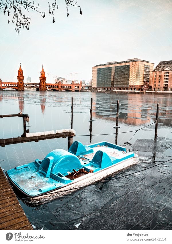 Oberbaumbrücke in the morning in winter with pedal boat Long shot Deep depth of field Sunbeam Reflection Contrast Shadow Light Morning Copy Space middle