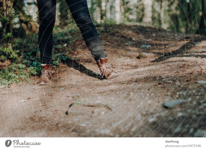 Legs of a young woman with black jeans and brown leather boots on a forest path Lanes & trails off Footwear Lifestyle Hiking Woman Woman's leg Vacation & Travel