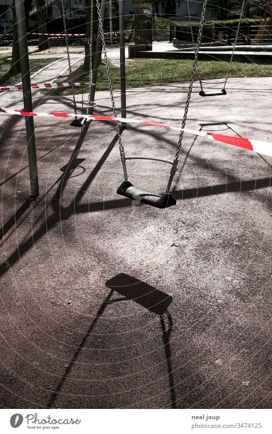 playground, swing, barrier tape Back-light Shadow Swing Playground Exterior shot Barred cordoned off forbidden corona crisis insulation Deserted Crisis
