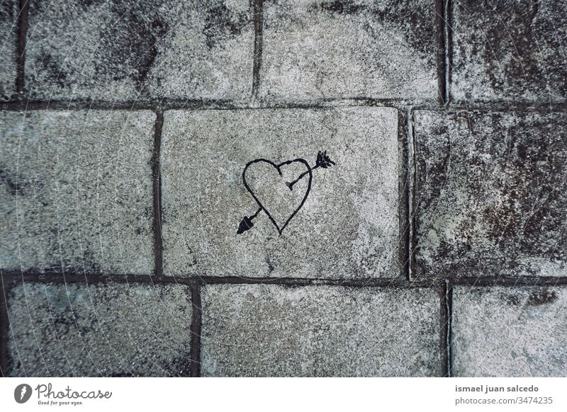 heart on the grey wall on the street, love is in the air arrow paint painting draw drawing gray textured background Draw Painting and drawing (object)