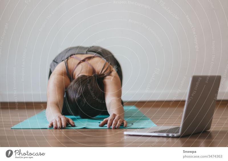 Teen girl doing yoga at home - a Royalty Free Stock Photo from Photocase