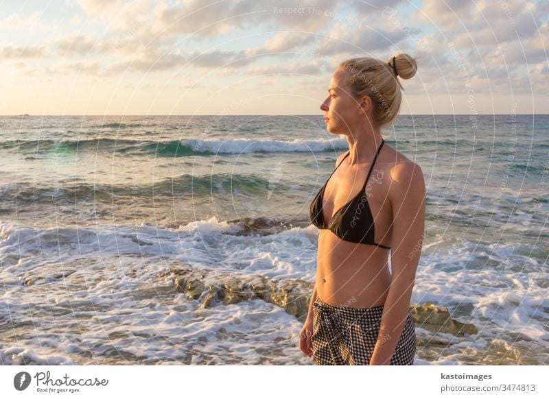 Relaxed Happy Woman Enjoying Sun on Vacations. woman nature free beach happy summer carefree relax freedom happiness young wellness girl beautiful beauty