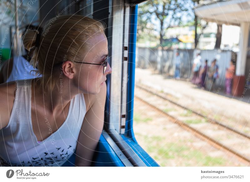 Young female adventurer traveling by train in Asia. woman journey transport passenger railway trip traveler transportation young person beautiful people