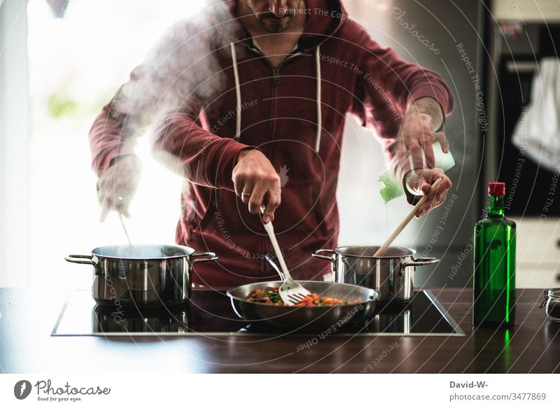 multitasking man Hausmann cooks several things at once under time pressure Man Talented swift Stress boil Hurry Photomontage Creativity Boil housework
