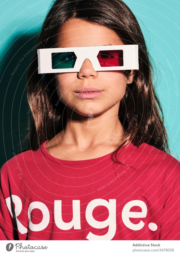 Pensive pleased girl in 3d glasses cinema kid brunette preteen stereoscopic woman happy spectacles childhood female illusion dimensional optical entertain