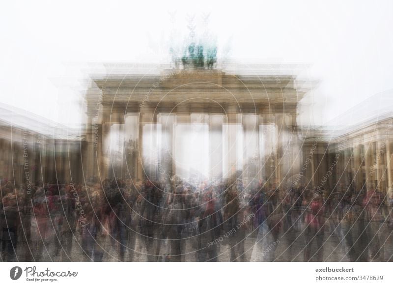 multi exposure of Brandenburg Gate with tourist crowd in Berlin Germany brandenburg gate berlin germany brandenburger tor landmark tourism unrecogniazble group
