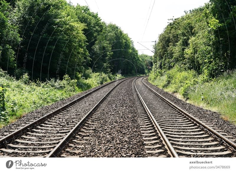 empty railroad railway or train tracks background with copy space travel concept journey traveling voyage trip transportation wanderlust travel bug distance