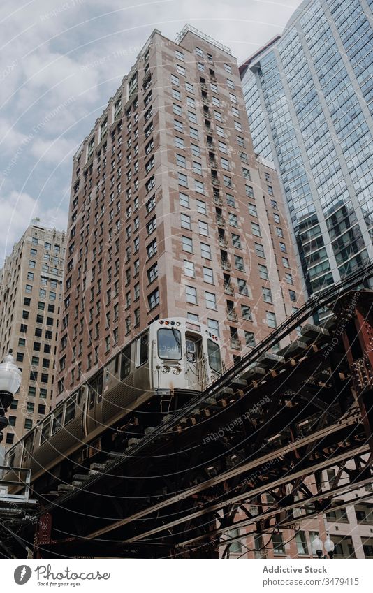 Train on elevated road near modern buildings city train architecture chicago urban street construction transport commute contemporary district downtown