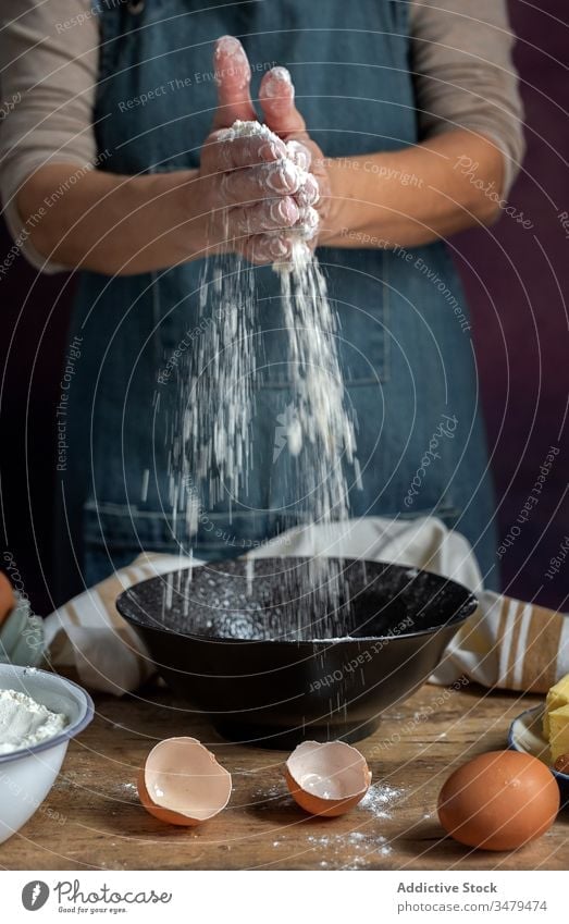 A Women Hand Mix Flour in a Bowl, Preparation for Baking a Cake. Suitable  for Baking Background and Wallpaper Stock Photo