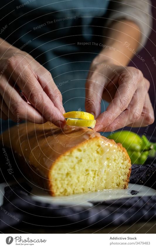 Anonymous person preparing homemade lemon cake pastry baking confectionery dough kitchen gourmet cloth fruit sugar cooking table natural recipe culinary rustic