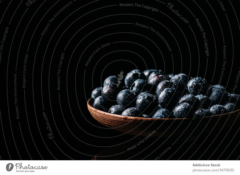 Fresh blueberries on wooden bowl on table blueberry dark food fresh natural ripe delicious tasty ingredient healthy nutrition vegetarian vitamin raw meal