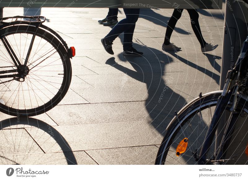 shading of free-wheeling legs in the pedestrian zone in search of a good bike pedestrian shades people Bicycle City life Legs Going Walking Shadow bicycles