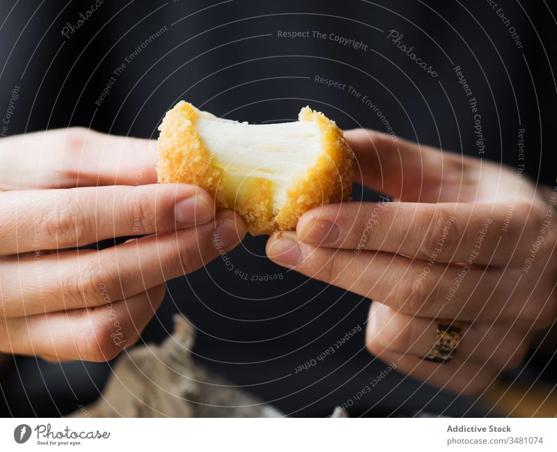 Woman eating cheese balls in cafe woman fried snack delicious fast food crispy tasty fill mozzarella stretch meal female positive cuisine table nutrition dish