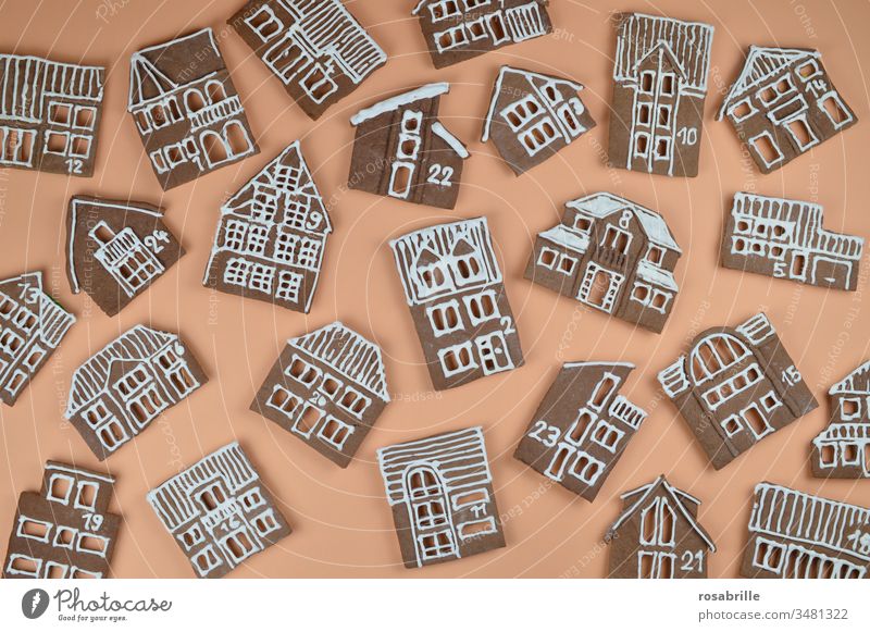 Gingerbread Advent calendar homemade with house facades jumbled up on orange | anticipation Gingerbread houses Christmas bakery Baking Town Village Orange