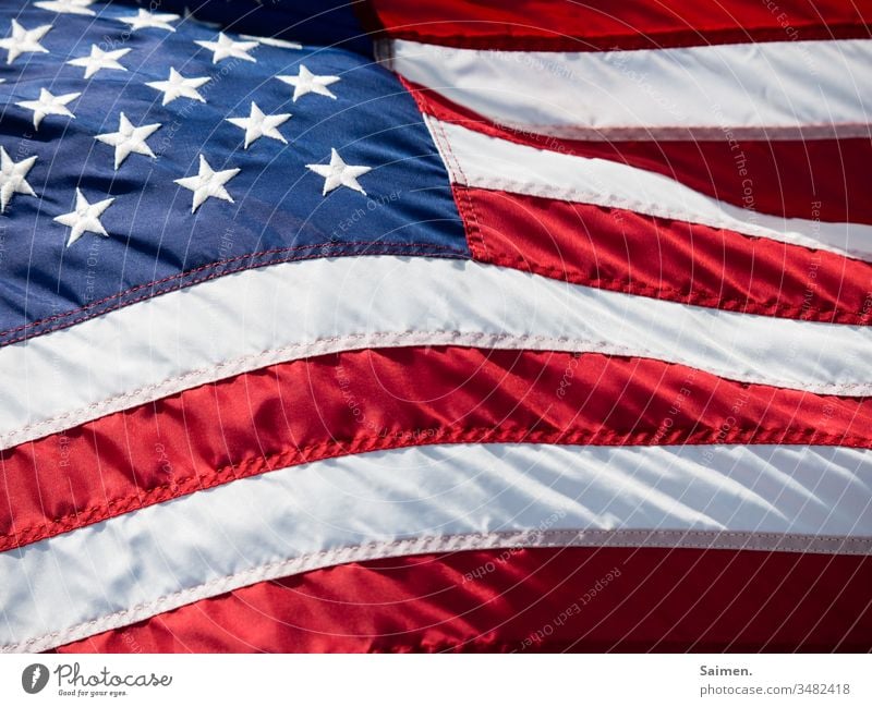 Stars&Stripes Americas flag Flag USA Wind Blow Colour photo stars Lines and shapes seams Red Blue Freedom White Independence patriotically Symbols and metaphors