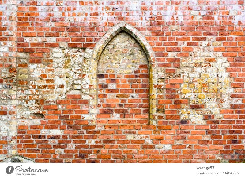Bricked up pointed arch in a brick wall Ogival arch Ogival windows bricked up Bricked opening Wall (barrier) Wall (building) Deserted Colour photo Exterior shot