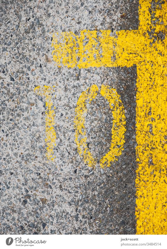 Number 10 next to the yellow parking space markings Symmetry Ground markings Ravages of time Under Gray Line Simple Structures and shapes Detail Marker line