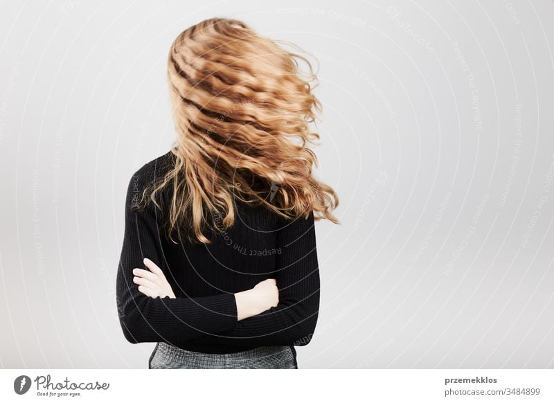 Cute teenager girl with long and straight hair - a Royalty Free Stock Photo  from Photocase