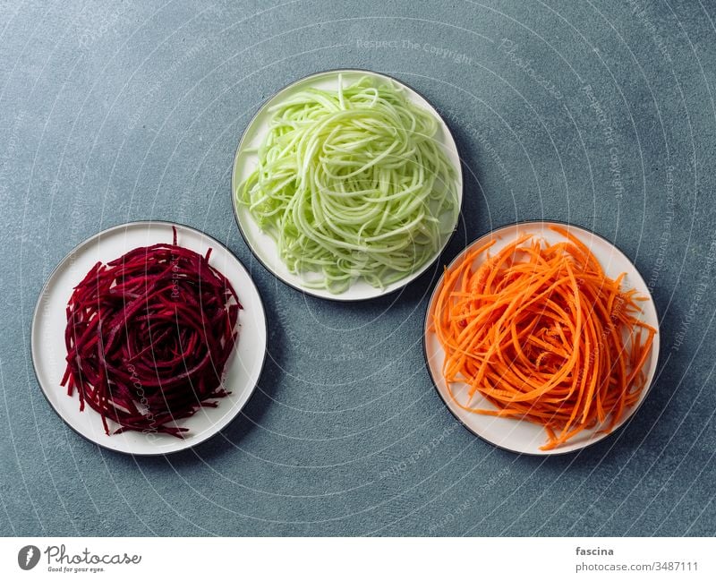 zucchini, carrot, and beetroot noodles, copy space vegan vegetarian raw squash spaghetti zoodles top view clean eating diet food fresh healthy lunch preparation