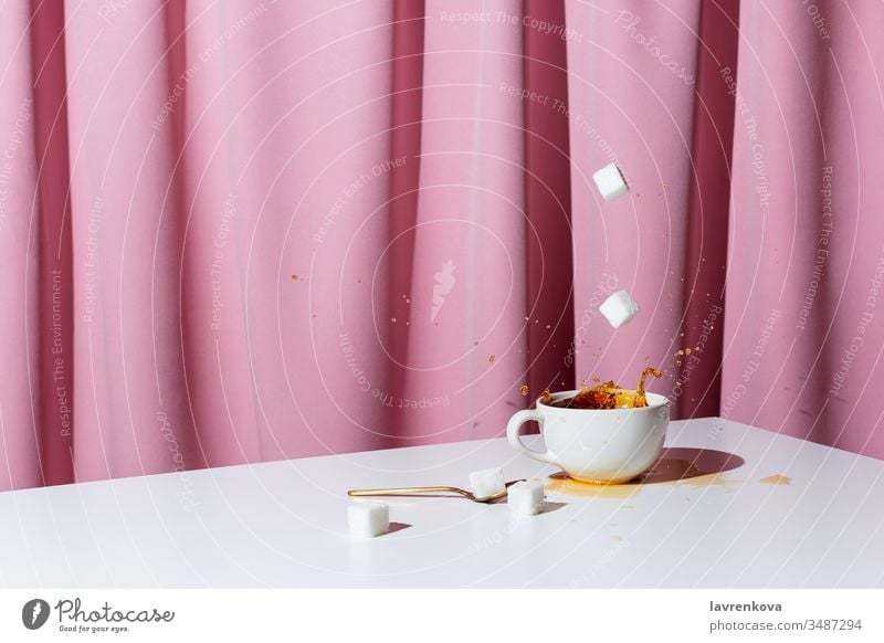 https://www.photocase.com/photos/3487294-cup-of-tea-or-coffee-on-white-table-in-front-of-pink-drapery-selective-focus-photocase-stock-photo-large.jpeg