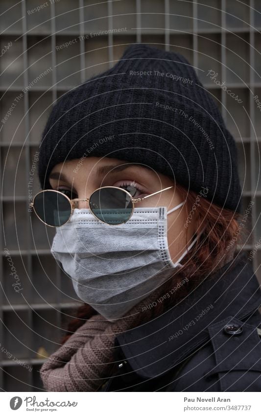 Close up of Woman Covering Her Face With Protective Mask. Virus concept protection medical equipment face mask epidemic coronavirus protective quarantine safe