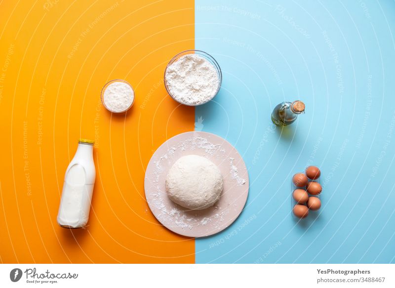 Dough and bake ingredients top view, colorful background above view bakery baking bread baking stone blue dough flat lay flour food food ingredients
