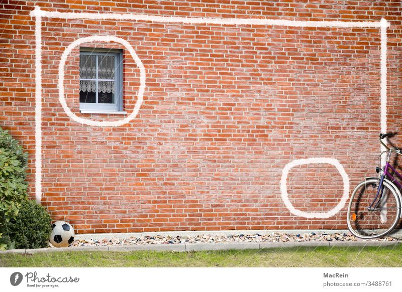 goal wall soccer wall Foot ball Ball workout exercise Bicycle house wall Window Brick wall Wall (building) painting painted on chalk stripes White nobody