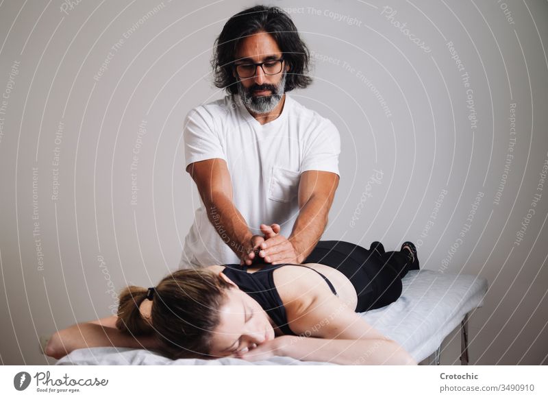 Kinesiology Physiotherapy. Caucasian man attending his clinic. alternative aromatherapy arthritis back being bodycare bone chiropractor cosmetic dayspa doctor