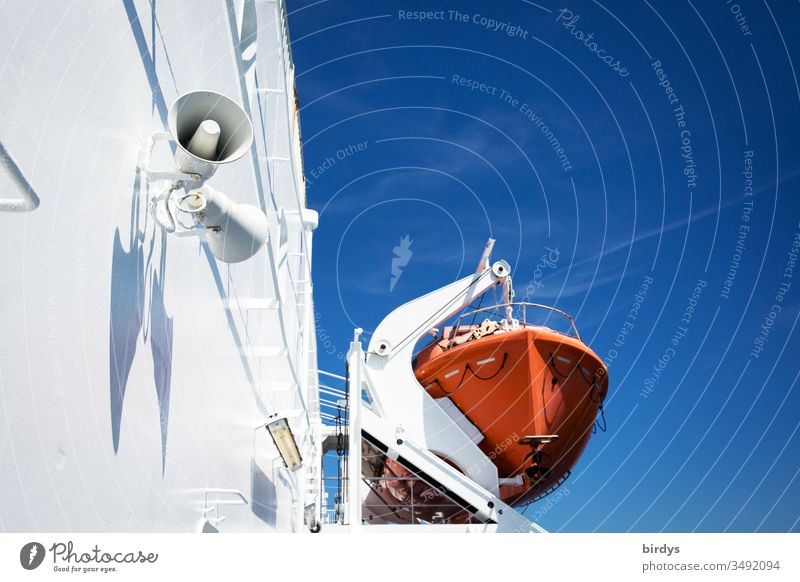 Red lifeboat on a white ship against a blue sky, sea rescue, refugees Lifeboat Navigation Maritime Deserted Boat refugees Colour photo Exterior shot Day