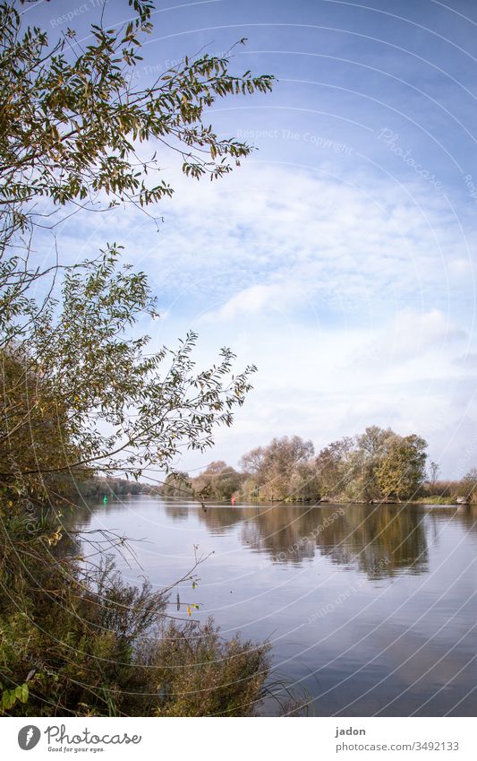 the river lies still, it is still april. white clouds pass by, tomorrow is may. river landscape River Water Exterior shot Nature Landscape Colour photo Deserted