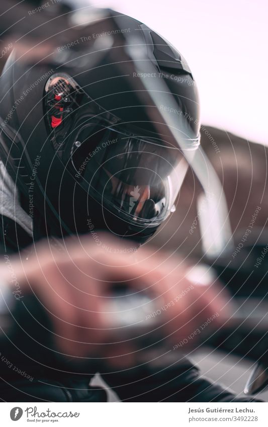 Motorcyclist with black helmet with his hand on the gas Central perspective Sunset Sunrise Wild Speed Motorcycle Motorsports Motorcycling Movement Car Vehicle