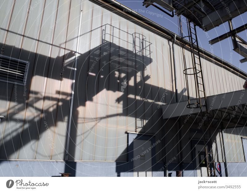 Shadow of industry on a sunny day Stairs Architecture rail Shadow play Ladder Building Wall (building) Abstract Silhouette Assembly shop Industrial plant