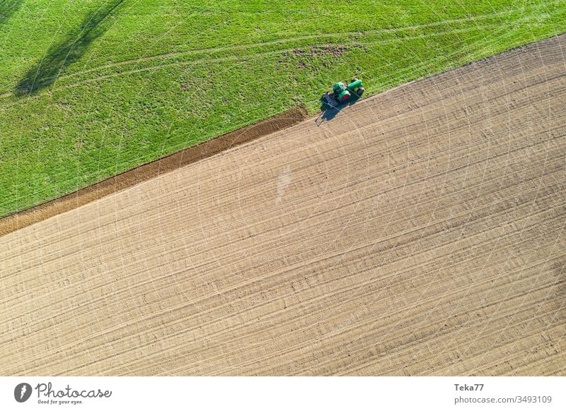 tractor digs a field from above tractor from above historic tractor green tractor tractor on a field agricultural agricultural way tractor path field background
