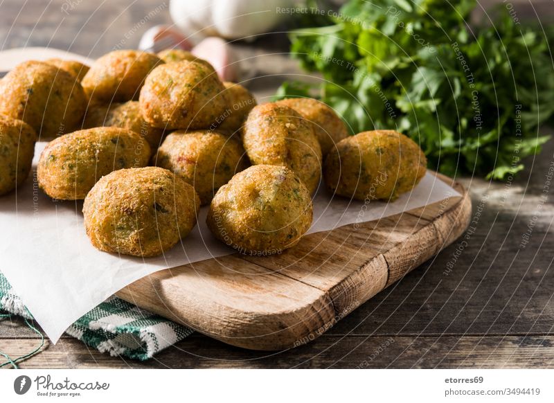 Traditional cod fritters with garlic and parsley accras de morue bacalao balls buñuelos cod cake croquette cut out dish fish food fried holidays holy week meal