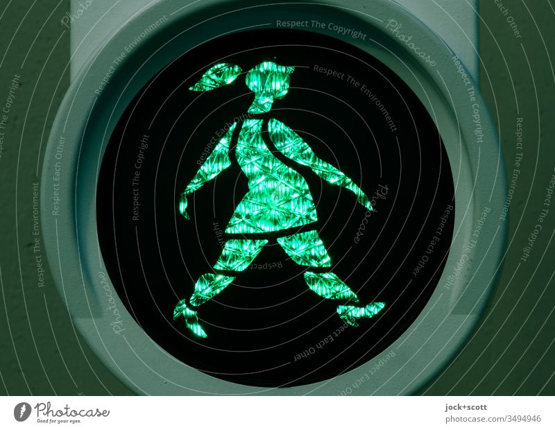 Dutchwoman goes swinging at green Pedestrian traffic light ampelmännchen Back-light visually Design Symbols and metaphors Light (Natural Phenomenon) Silhouette