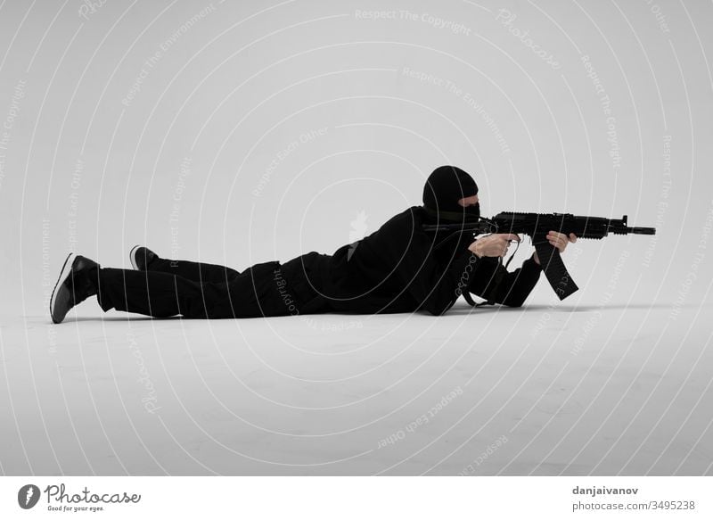 Man in mask With gun on white background aggression armed balaclava black crime criminal danger evil hand holding isolated killer male men murder people person