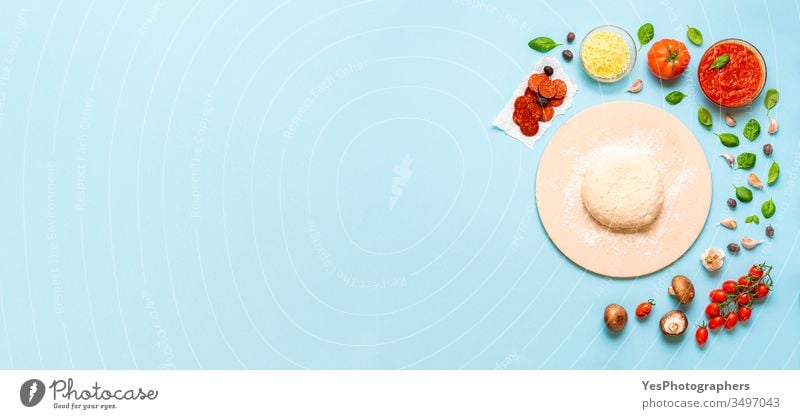 Preparing pizza concept. Ingredients and dough for pizza above view banner basil blue background cheese colorful convenience food cooking copy space cuisine