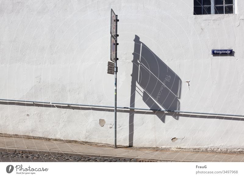 the shadow next to the signs | minor matter Wall (building) Building Facade Window Lattice window street sign mountain road Plaster peeled off handrail Sidewalk