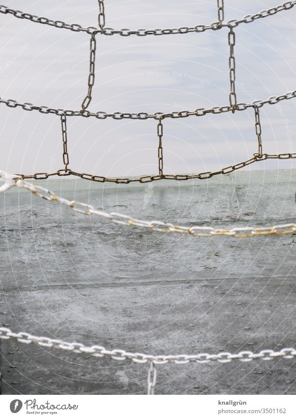 Entry on a ship, locked by connected chains cordon Navigation Safety entry Chain links Plank Water silver Gray Metal Connection ally Rectangle Exterior shot