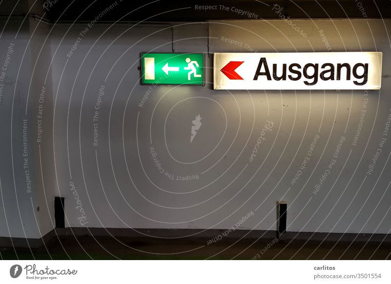 The escape route is the exit - or is it the other way round? Parking garage Escape route Way out Emergency exit Signage Signs and labeling Arrow Warning sign