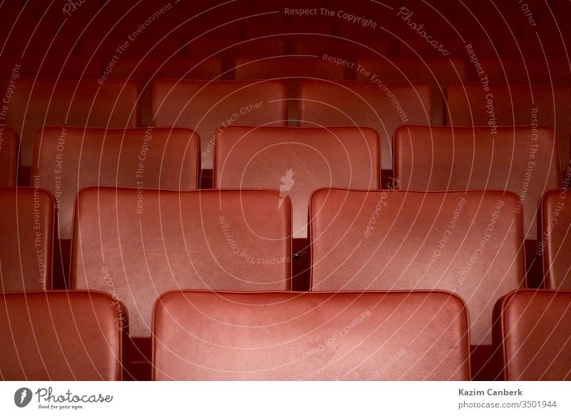 Empty red seats of a theater after the curfew regarding corona virus art opera theatre cinema closed empty quarantine global pandemic covid 19 social life
