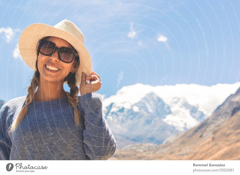 Beautiful woman enjoying the mountainous landscapes of the Callejon de Huaylas, Huraz. Peru. yellow wellness wilderness tourism hike relaxation inspiration