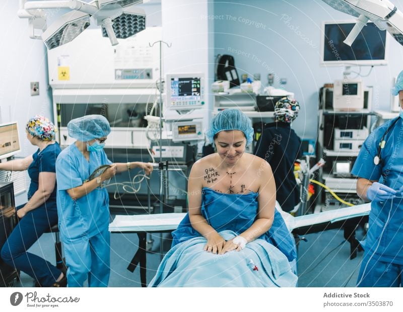 Surgeon taking picture of patient breast surgeon take photo hospital mammoplasty woman professional medicine nude clinic device gadget doctor job work female